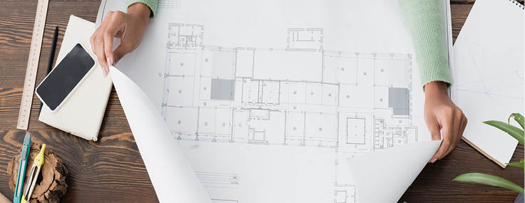 cropped view of african american architect near blueprint and smartphone with blank screen, banner